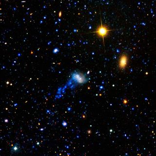 Cosmic Hit-and-Run Gives Galaxy Starry Tail 