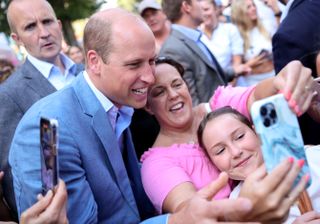 Prince William taking selfies with fans