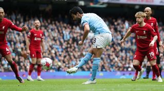 Manchester City's Ilkay Gundogan scores his side's third goal in the 4-1 win over Liverpool in the Premier League in April 2023.