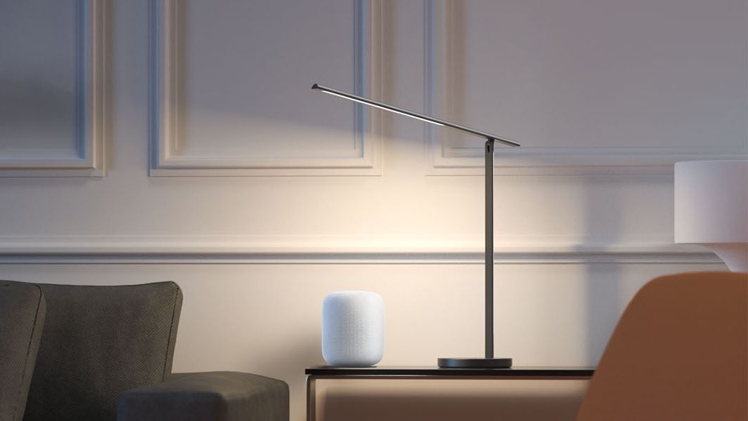 Meross Mdl110m Smart Led Desk Lamp on a table next to a HomePod