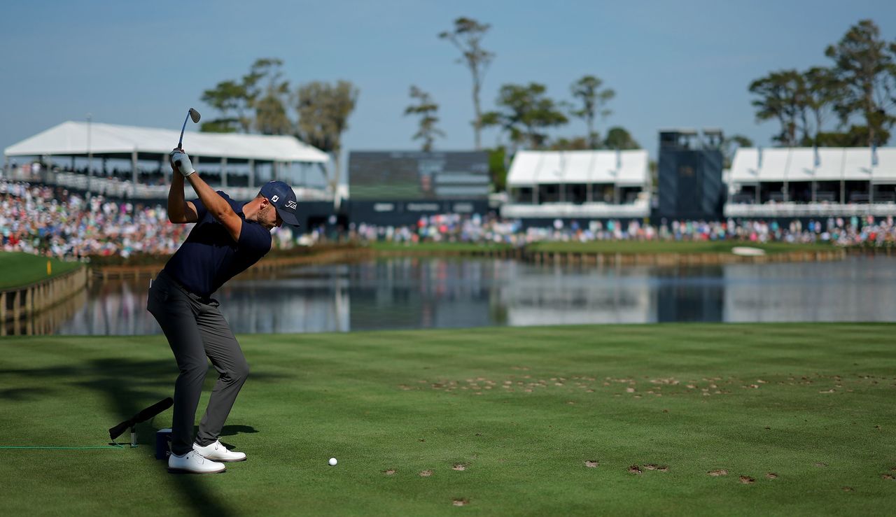 Wyndham Clark at the top of his backswing at the 17th hole at TPC Sawgrass