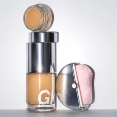 A pair of Glossier cosmetic products.