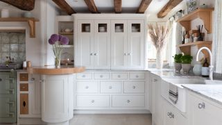 white shaker style kitchen in oak frame house