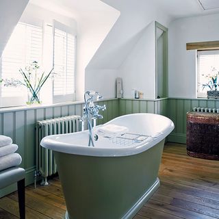 bathroom with bathtub and wooden flooring