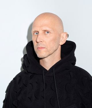 Wayne McGregor in black hoodie