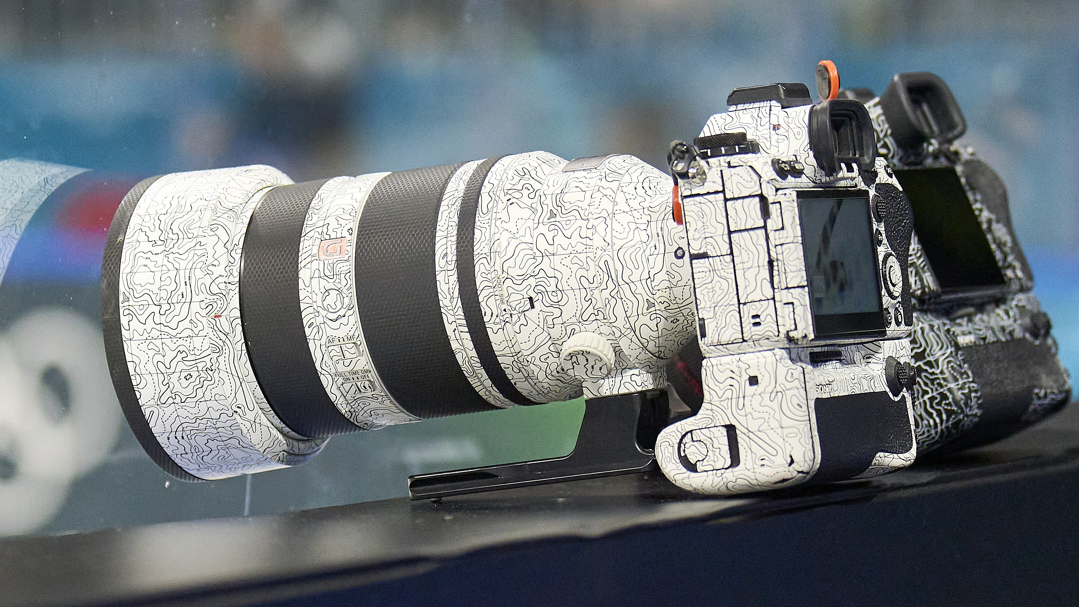 A mystery Sony camera wearing a white and black patterned skin