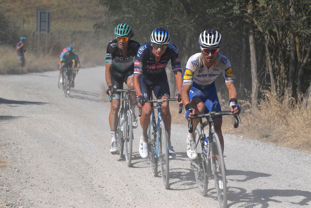 SIENA ITALY AUGUST 01 Julian Alaphilippe of France and Team Deceuninck QuickStep Mathieu Van der Poel of The Netherlands and Team AlpecinFenix Daniel Oss of Italy and Team BoraHansgrohe during the Eroica 14th Strade Bianche 2020 Men a 184km race from Siena to SienaPiazza del Campo StradeBianche on August 01 2020 in Siena Italy Photo by Tim de WaeleGetty Images