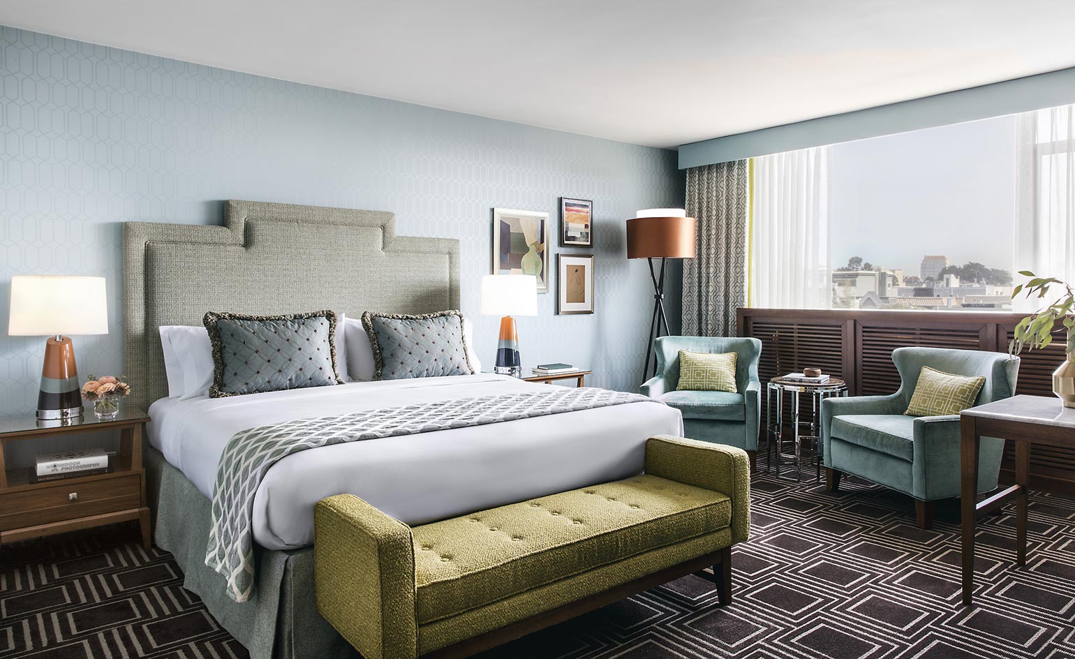 Bedroom with grey coloured bed and floor lamp