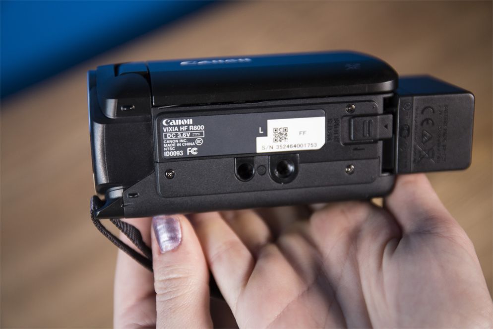 Removing the battery is as easy as sliding the small plastic lever on the bottom of the Canon Vixia.