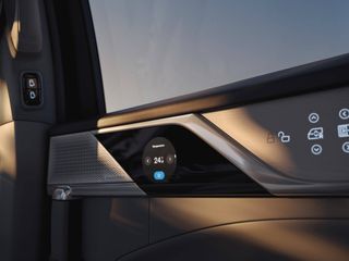 Volvo EM90 MPV control details in door panel