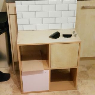 kitchen in progress with wooden drawer and wooden flooring