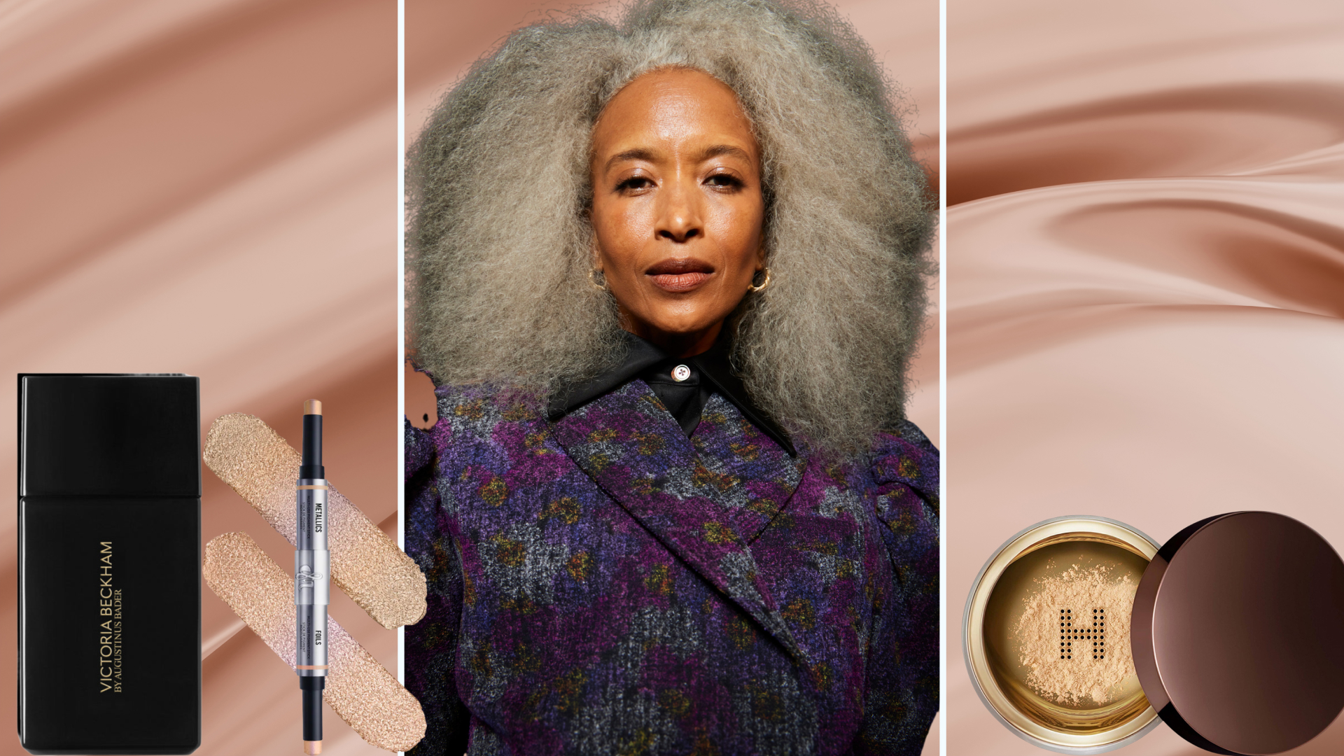 A woman with grey hair surrounded by makeup products