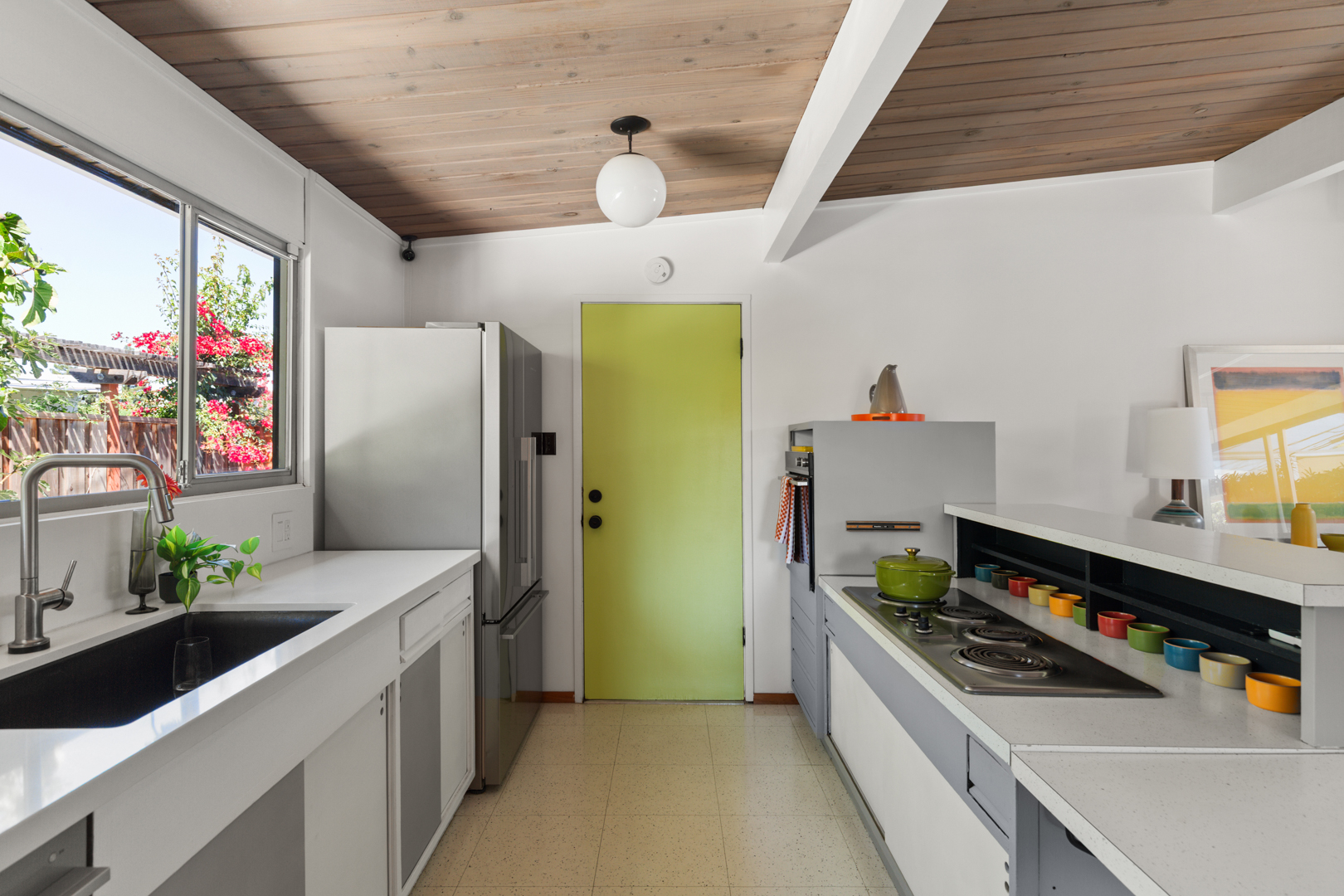 The galley kitchen has been subtly updated