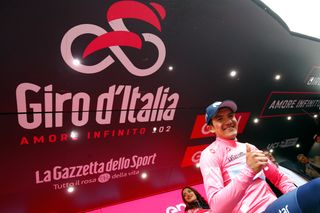 Richard Carapaz in pink on the Giro podium after stage 14