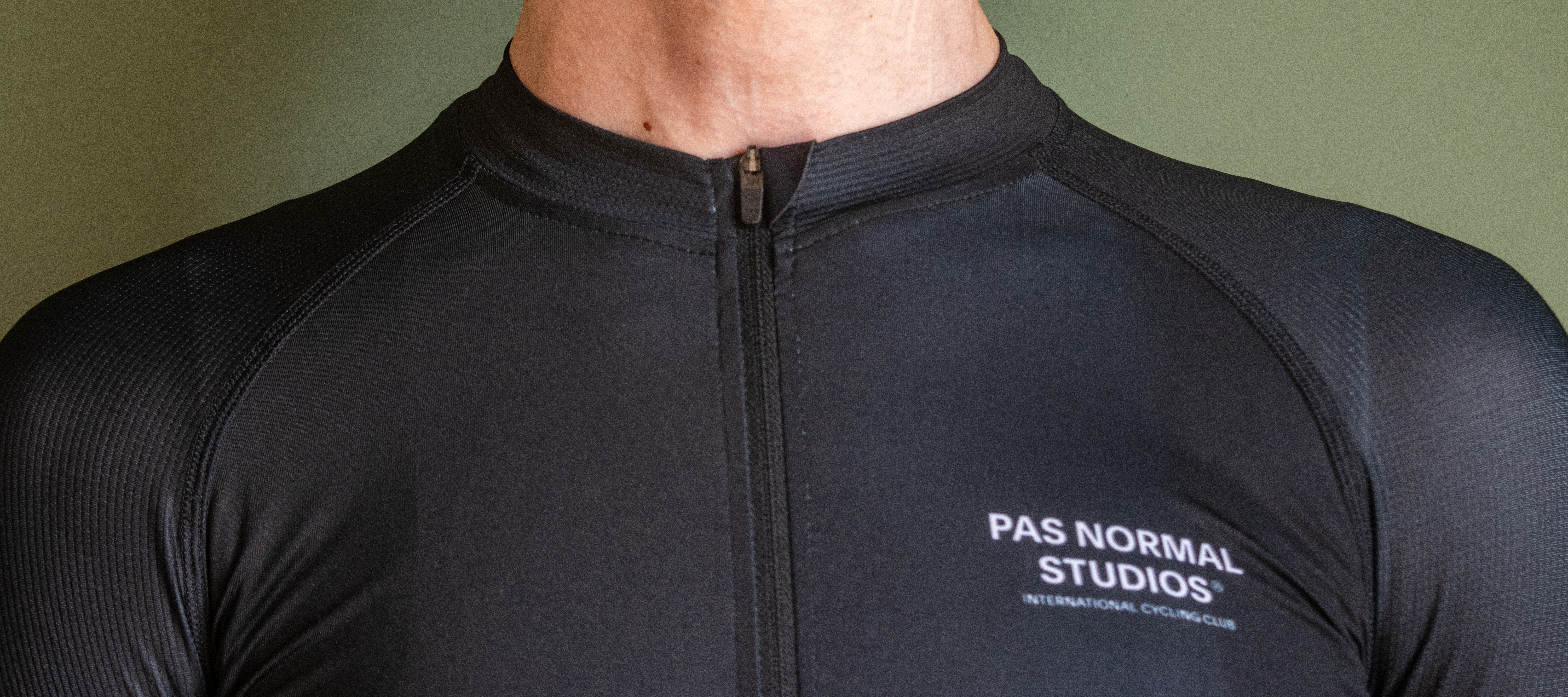 A man wearing a black PNS Mechanism jersey 