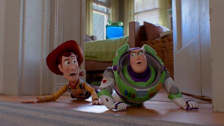 Woody (Tom Hanks) and Buzz Lightyear (Tim Allen) are watched by Lilypad (Greta Lee) in Toy Story 5.