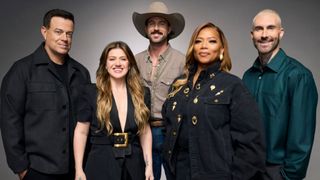 The Voice Season 30 coaches (and host) Carson Daly, Kelly Clarkson, Riley Green, Queen Latifah and Adam Levine are shown.