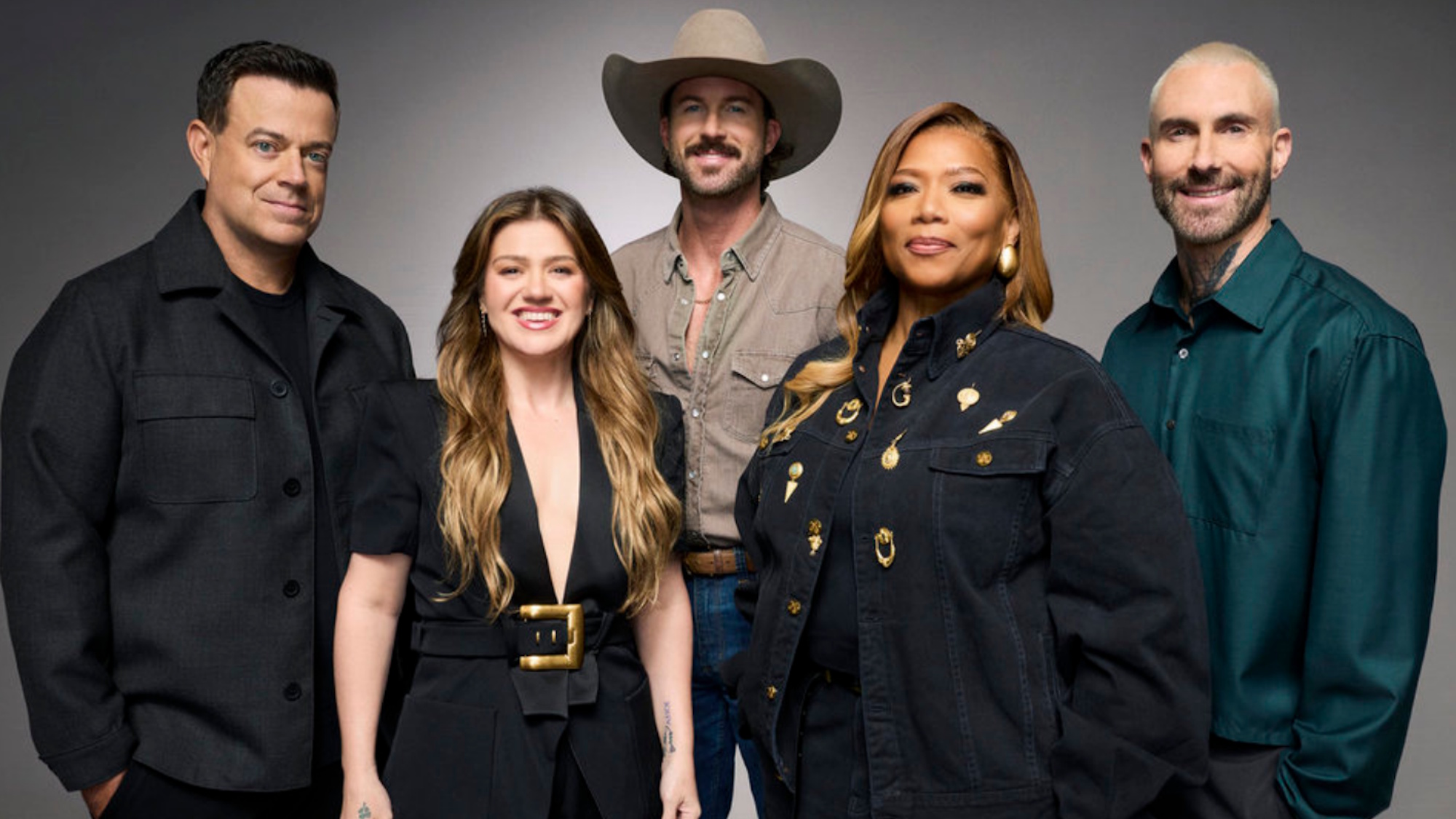 The Voice Season 30 coaches (and host) Carson Daly, Kelly Clarkson, Riley Green, Queen Latifah and Adam Levine are shown.