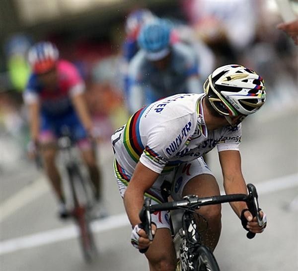 Winner Paolo Bettini (Quick Step) checks his back on his way to a win.