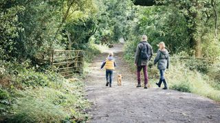 family and dog walk
