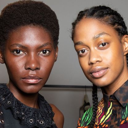 two models looking directly at the camera - Eyebrow threading - getty 1276958072