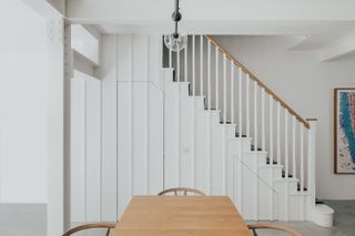 white staircase with white panelling