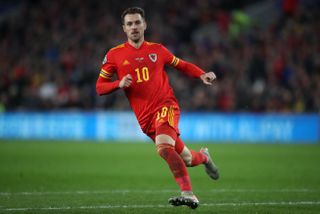 Aaron Ramsey will miss the match against England