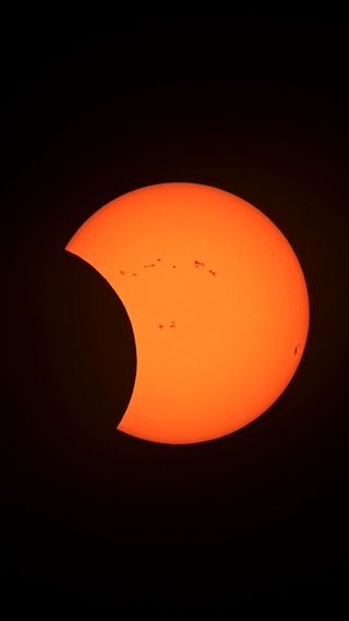 During the annular solar eclipse, the sun is increasingly obscured by the moon