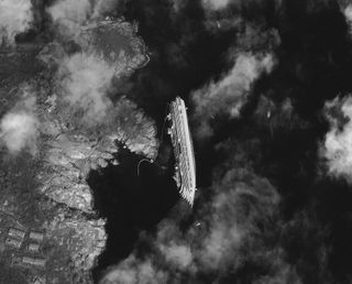 The Italian cruise liner Costa Concordia founders off the coast of Tuscany on Jan. 17 in this image captured by a satellite. The ship hit a rock and capsized on Jan. 13, triggering a hectic, poorly planned evacuation and a manslaughter charge for the captain, who was among the first to bail out from the sinking ship.