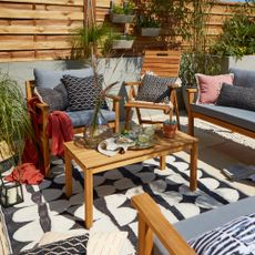 outdoor plant with wooden table and chair