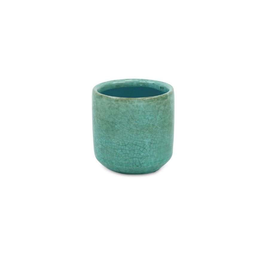 A green ceramic plant pot