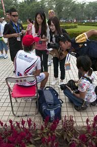Tour leader Justin Jules (Velo Club/La Pomme Marseille) is interviewed by local media in Danzhou.
