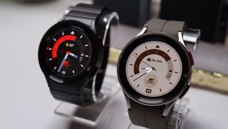 Two Samsung Galaxy Watch 5 Pros on stands next to each other