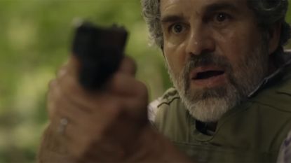 Mark Ruffalo aims a gun in the trailer for Task