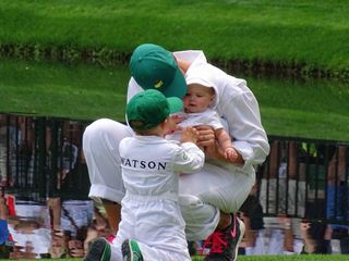 Angie, Caleb and Dakota Watson wait by the 9th green