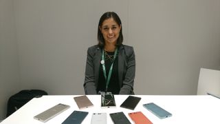 Diana Hernandez poses with the company's newest smartphones at IFA 2017