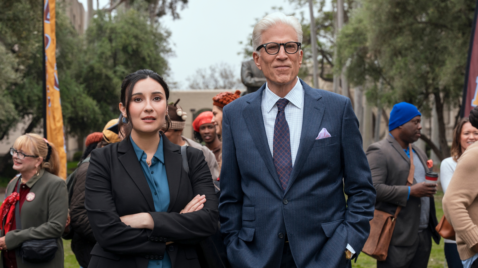 Lilah Richcreek Estrada as Julie and Ted Danson as Charles standing together on a college campus in a man on the inside season 2