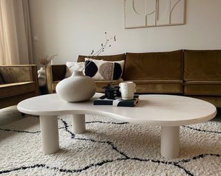 A curved wooden DIY coffee table