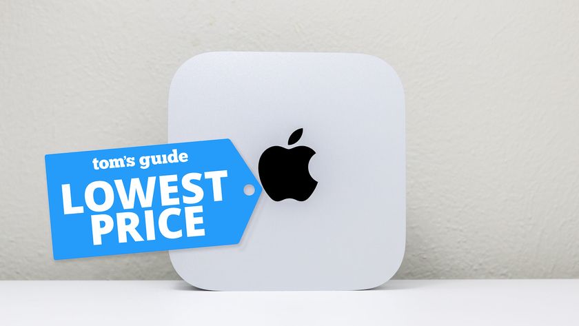 The Mac mini M4 on a desk with the Tom&#039;s Guide lowest price deals badge on top