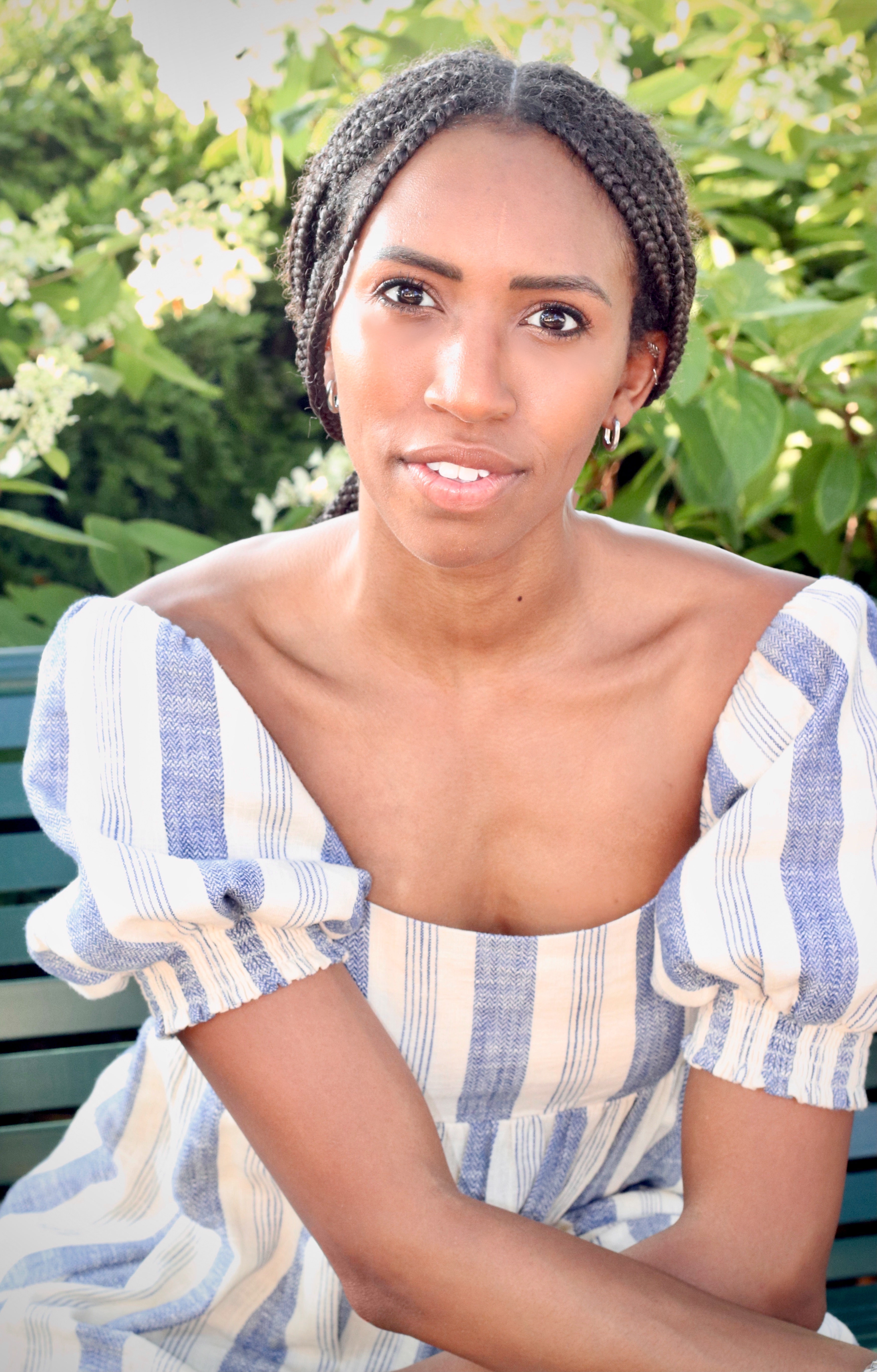 Keta Burke-Williams in a blue and white stripe dress