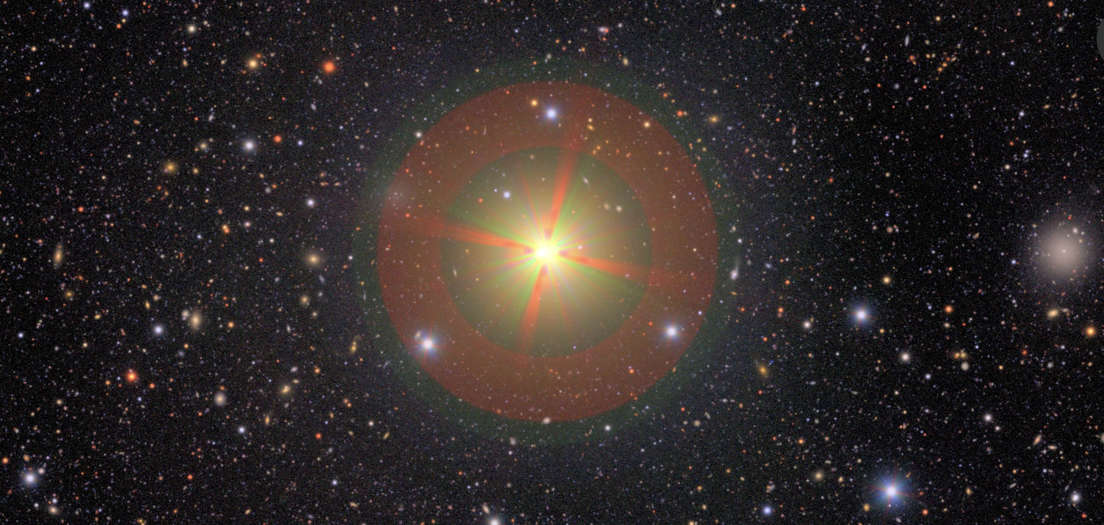 an image of a brightly glowing star with a red lens flare in outer space