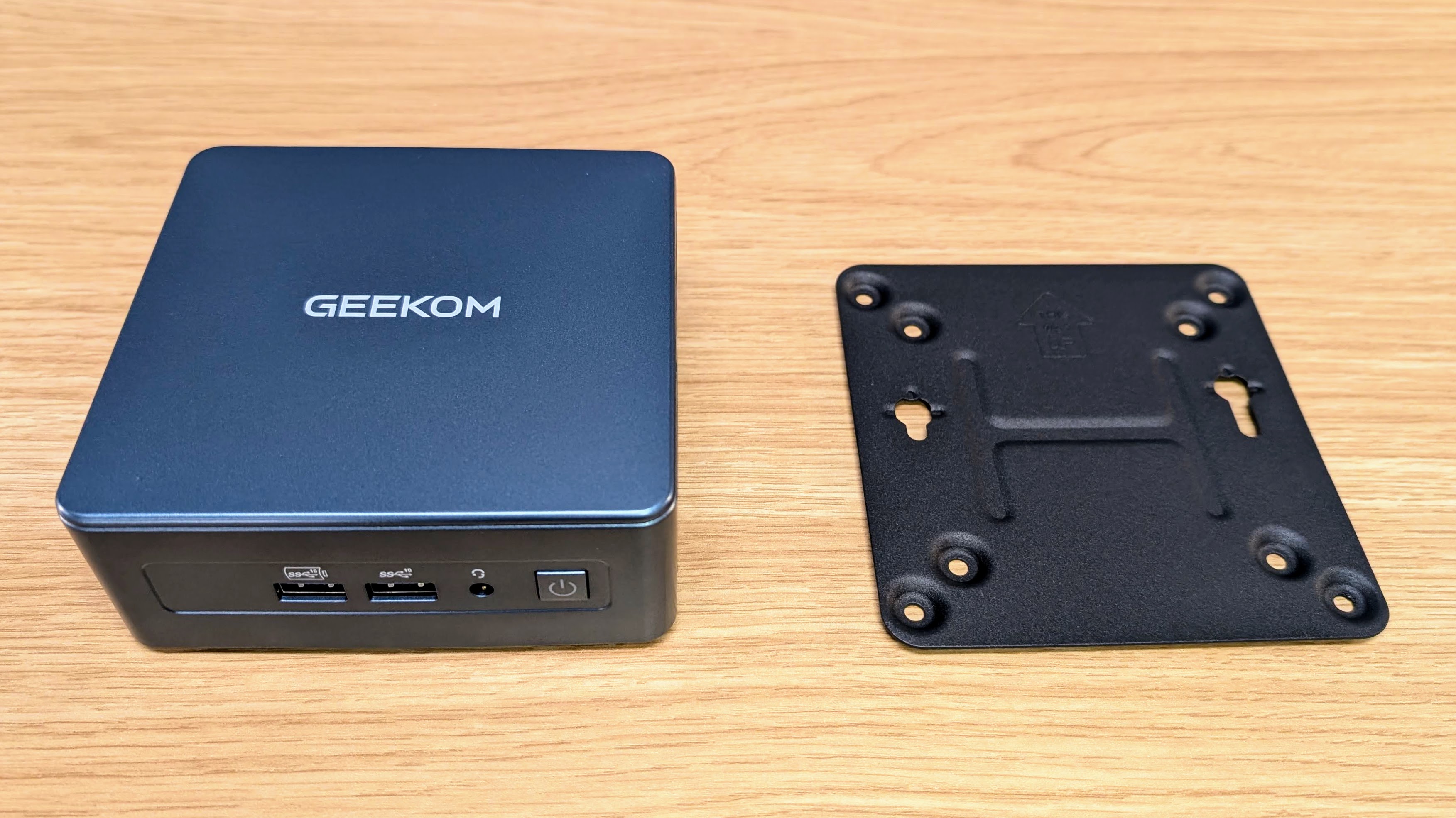 Geekom IT12 mini PC alongside VESA mount