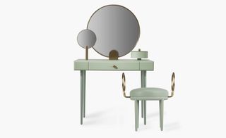 ’Rose Selavy’ vanity desk. A pastel green vanity desk with a single drawer and two round mirrors next to a single seat bench.