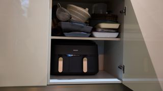 Philips 3000 Series Dual Basket Air fryer fitting in a kitchen cupboard