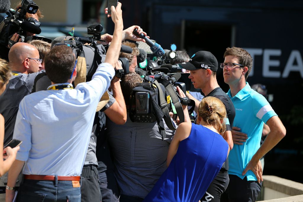 Chris Froome (Team Sky) is surrounded by camers