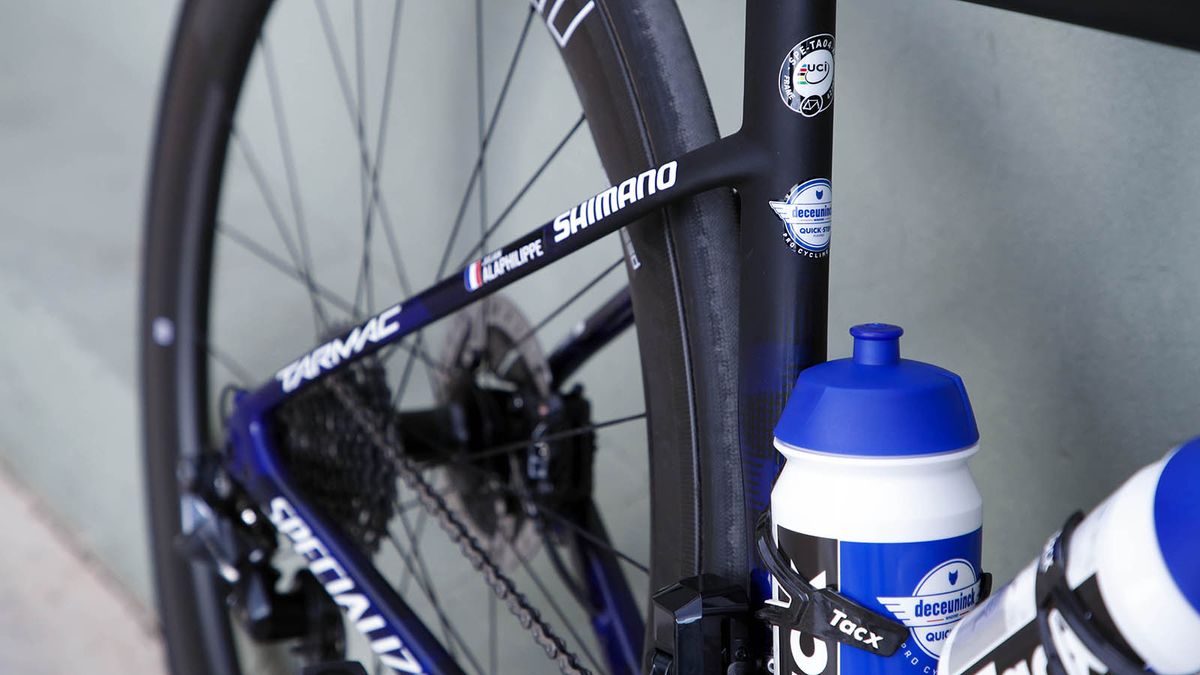 The blue design fades into a raw carbon finish