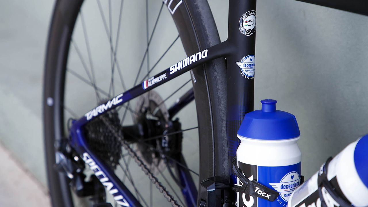 The blue design fades into a raw carbon finish