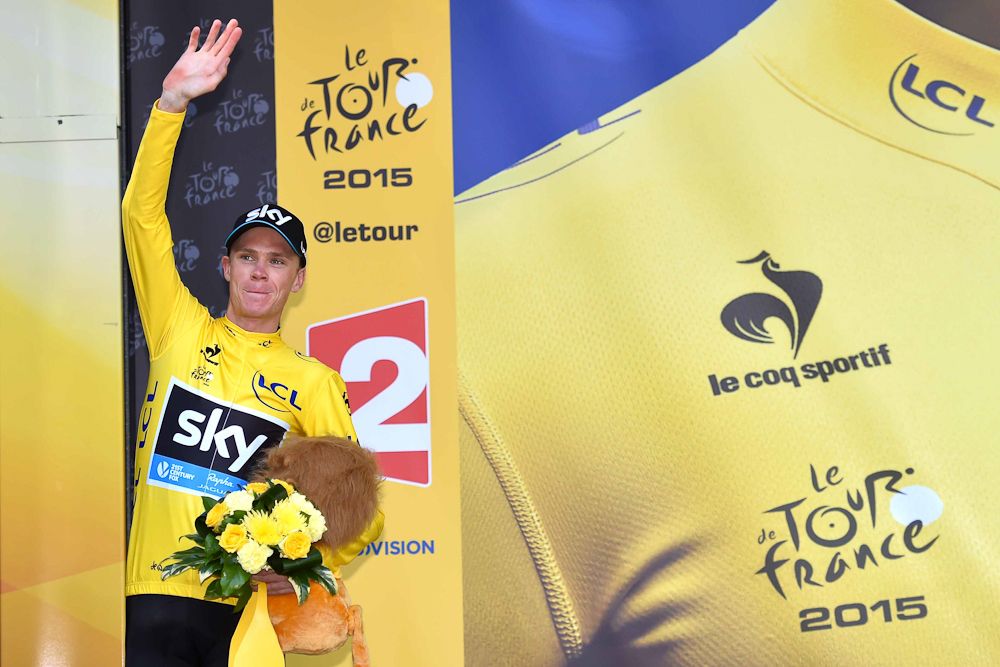 Chris Froome in yellow on the stage18 podium.
