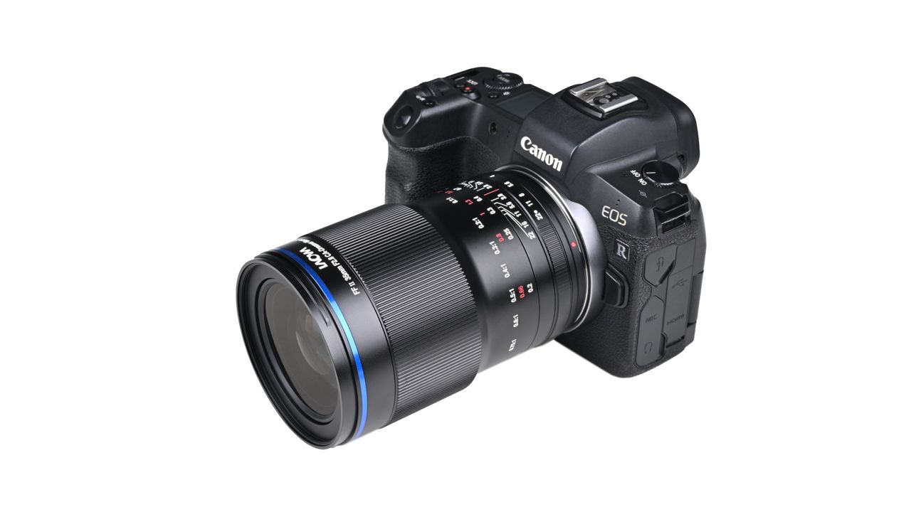 Laowa Acris 35mm f/2.8 1x Macro Apo lens mounted to a camera against a white background