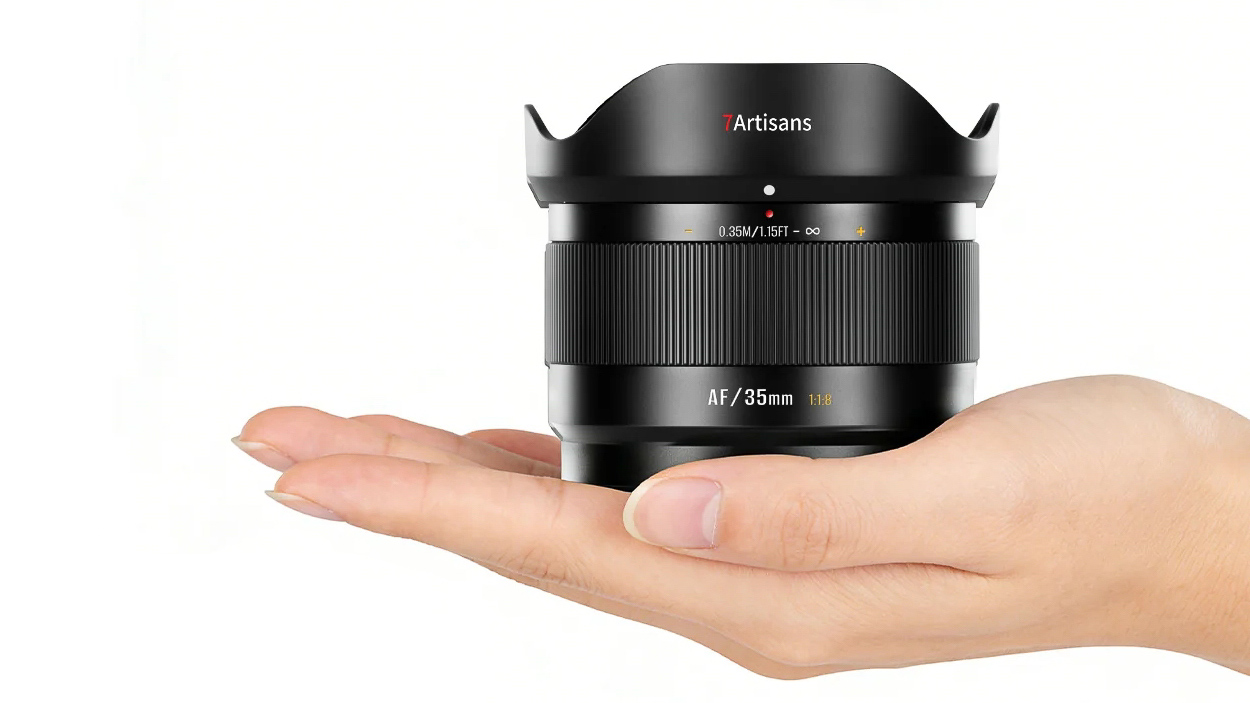 7artisans 35mm f/1.8 Lite lens on the palm of someone's hand